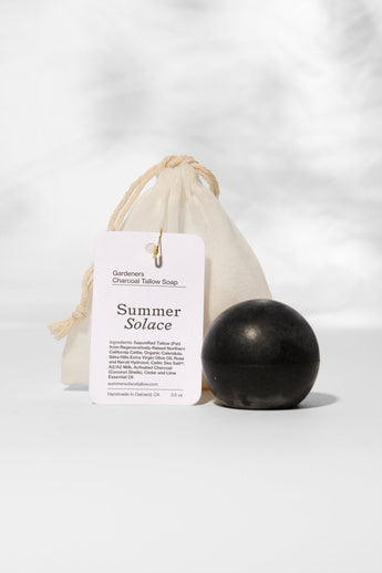 Summer Solace Tallow Gardener’s Sphere Soap with activated charcoal, cedar, and lime, showcasing the tallow soap bar with natural ingredients.